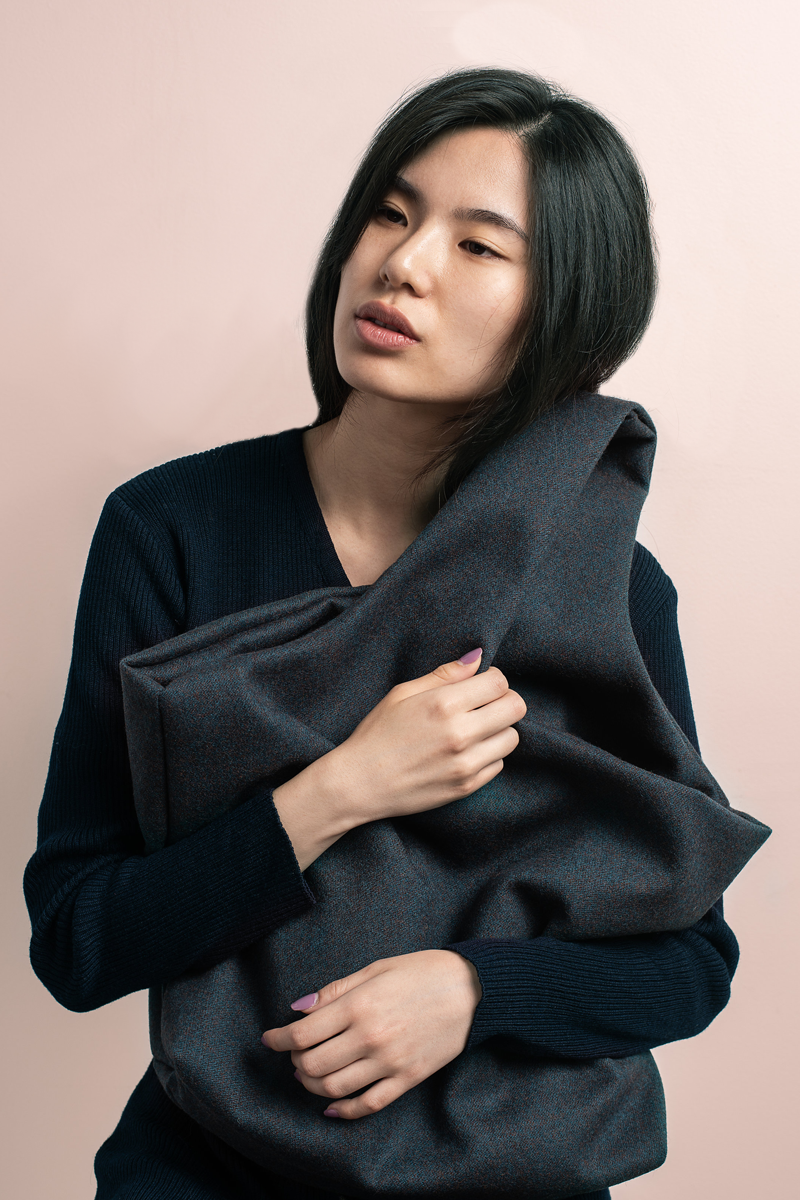 Woman caring for Elly Arif handbag